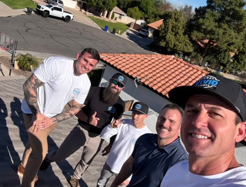Vivid Roofs team on a roof together